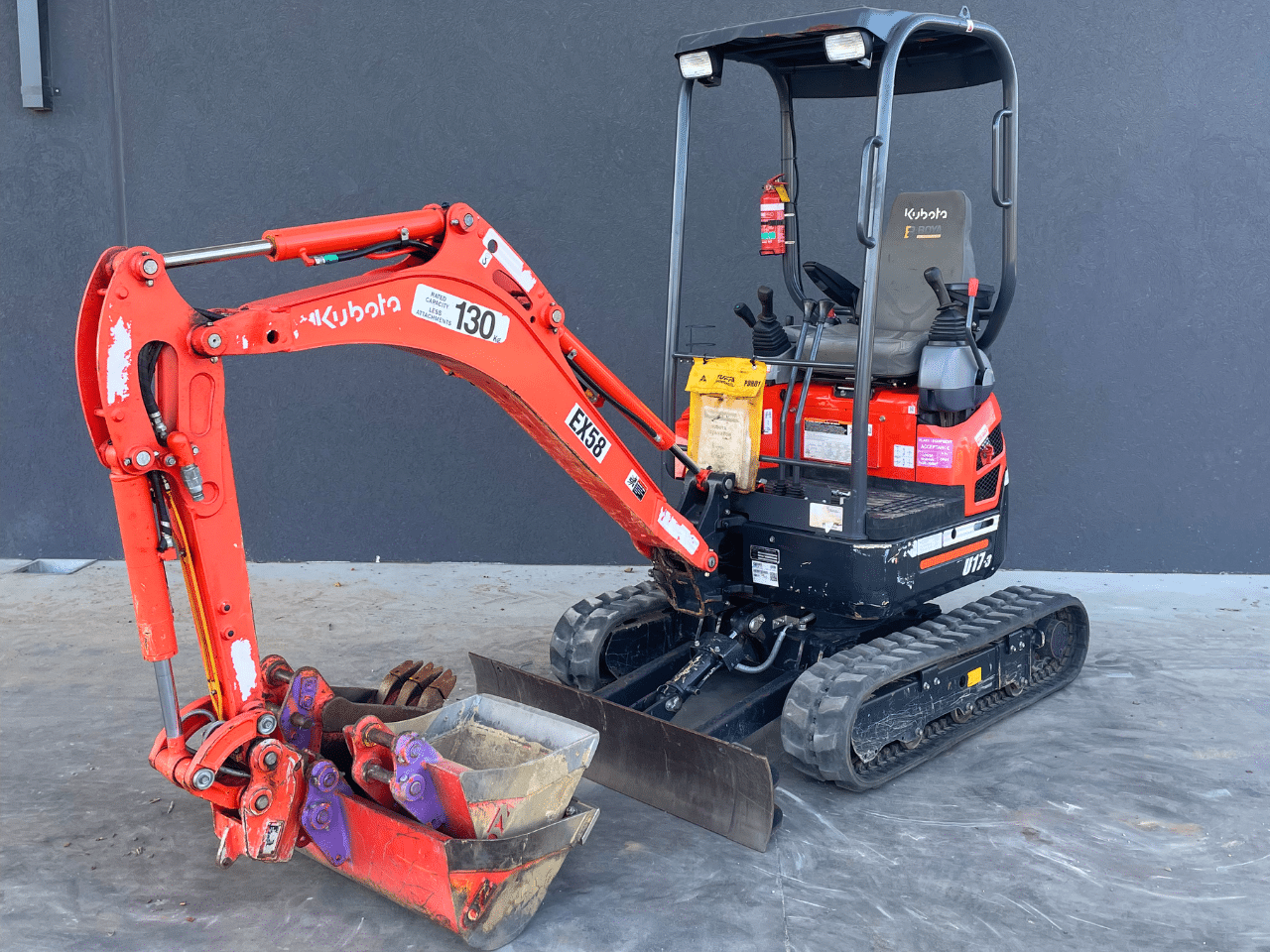 Kubota 1.7t mini excavator with full bucket set on a job site
